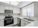 Well-equipped kitchen with stainless steel appliances and ample counter space at 818 S Westwood -- # 101, Mesa, AZ 85210