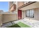 Cozy patio area with tile floors, artificial turf, and stucco walls at 818 S Westwood -- # 101, Mesa, AZ 85210