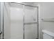 Bathroom shower featuring a glass sliding door and tile surround at 818 S Westwood -- # 101, Mesa, AZ 85210