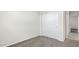 Neutral bedroom featuring soft carpet and a sliding door closet at 91 S Collier Ln, Casa Grande, AZ 85122