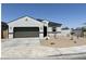 Charming single-story home with a two-car garage and low-maintenance desert landscaping at 91 S Collier Ln, Casa Grande, AZ 85122