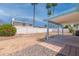Large backyard with a covered patio and block fence providing privacy at 962 W Keating Ave, Mesa, AZ 85210