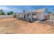 A spacious backyard featuring a covered patio and ample space for outdoor activities at 962 W Keating Ave, Mesa, AZ 85210