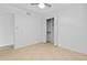 Bedroom featuring tile flooring and closet with folding doors at 962 W Keating Ave, Mesa, AZ 85210