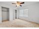 Spacious bedroom with carpet flooring and bi-fold closet doors at 962 W Keating Ave, Mesa, AZ 85210