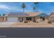 Charming single-story home featuring solar panels and a well-maintained desert landscape at 962 W Keating Ave, Mesa, AZ 85210