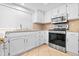 Modern kitchen featuring white cabinetry, sleek countertops, and stainless steel appliances at 962 W Keating Ave, Mesa, AZ 85210
