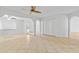 Spacious living area with tile flooring, ceiling fan, and archways into other rooms at 962 W Keating Ave, Mesa, AZ 85210