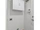 Storage with clean white wall cabinet, controls, and a door to the left at 962 W Keating Ave, Mesa, AZ 85210