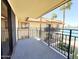 Balcony with black iron railing overlooking lake with palm trees and building at 10330 W Thunderbird Blvd # B313, Sun City, AZ 85351