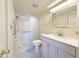 Bright bathroom features a shower and a vanity with ample storage at 10330 W Thunderbird Blvd # B313, Sun City, AZ 85351