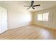 Bedroom featuring wood floors and view to the outside at 10330 W Thunderbird Blvd # B313, Sun City, AZ 85351