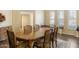 Open dining room boasting natural light, an elegant dining table, and room for entertaining at 10619 W Loma Blanca Dr, Sun City, AZ 85351