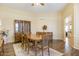 Traditional dining room with a china cabinet, table with seating for six, and trim detail at 10619 W Loma Blanca Dr, Sun City, AZ 85351