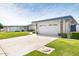 Charming single-story home with attached two-car garage and well-maintained landscaping at 10619 W Loma Blanca Dr, Sun City, AZ 85351