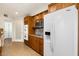 Kitchen boasts stainless appliances, wooden cabinets, granite counters, and ample storage space at 10619 W Loma Blanca Dr, Sun City, AZ 85351