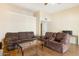 Bright living room with comfortable sofas, wood floors, and neutral walls providing a relaxing atmosphere at 10619 W Loma Blanca Dr, Sun City, AZ 85351
