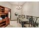 Dining area with stylish glass table and tiled floors at 10860 W Buccaneer Dr, Sun City, AZ 85351