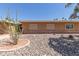Home's desert front yard features rock ground cover and vibrant plants at 10860 W Buccaneer Dr, Sun City, AZ 85351
