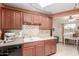 Well-lit kitchen features modern backsplash, countertops, and essential appliances at 10860 W Buccaneer Dr, Sun City, AZ 85351