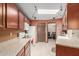 Kitchen features updated appliances and a skylight for natural light at 10860 W Buccaneer Dr, Sun City, AZ 85351