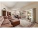 Cozy living room featuring a large sliding door to an outdoor space at 10860 W Buccaneer Dr, Sun City, AZ 85351