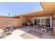 The patio of this home has grilling area, sitting area and access to home at 10860 W Buccaneer Dr, Sun City, AZ 85351