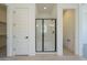 Bathroom with glass shower, white walls, and modern fixtures at 11002 N 164Th Dr, Surprise, AZ 85388