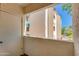 View from the balcony of the exterior of the building and some greenery at 12123 W Bell Rd # 219, Surprise, AZ 85378