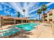 Beautiful community pool with lounge chairs and nearby clubhouse in a desirable neighborhood at 12123 W Bell Rd # 219, Surprise, AZ 85378