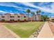 Beautiful lawn with lovely desert landscaping and tall palm trees surrounding the condos at 12123 W Bell Rd # 219, Surprise, AZ 85378