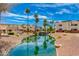Water feature and palm trees enhance the exterior and landscape view of these condo buildings at 12123 W Bell Rd # 219, Surprise, AZ 85378
