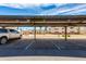 Carport parking with views of landscaping and condos behind provide shade for vehicles at 12123 W Bell Rd # 219, Surprise, AZ 85378