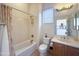 A full bathroom featuring a shower-tub combination, a mirror, and a single sink vanity at 12826 W La Vina Dr, Sun City West, AZ 85375