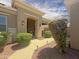 Inviting entrance with a covered porch, walkway, and well-maintained landscaping leading to the front door at 12826 W La Vina Dr, Sun City West, AZ 85375