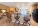Stylish kitchen island with bar seating overlooking an open floor plan, perfect for entertaining and Gathering gatherings at 12826 W La Vina Dr, Sun City West, AZ 85375