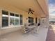 Spacious covered patio features a ceiling fan and plenty of room for outdoor dining and relaxing at 12826 W La Vina Dr, Sun City West, AZ 85375