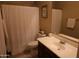 Clean bathroom with a shower, white vanity, and neutral wall color at 14977 W Charter Oak Rd, Surprise, AZ 85379