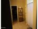 Bathroom showing shelf, tub, and access to walk-in closet at 14977 W Charter Oak Rd, Surprise, AZ 85379