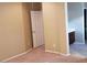 Bedroom featuring neutral walls and carpet flooring, with access to the bathroom at 14977 W Charter Oak Rd, Surprise, AZ 85379