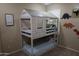 Playful bedroom showcasing a unique bunk bed design and fun decor elements at 14977 W Charter Oak Rd, Surprise, AZ 85379