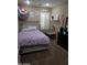 Cozy bedroom featuring a comfortable bed, playful unicorn-themed decor, and ample natural light through the window at 14977 W Charter Oak Rd, Surprise, AZ 85379
