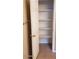 A view into a linen closet with a white door and several white shelves at 14977 W Charter Oak Rd, Surprise, AZ 85379