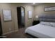 Relaxing bedroom featuring a plush bed, neutral tones, and ensuite bathroom access at 14977 W Charter Oak Rd, Surprise, AZ 85379