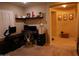 Functional home office with built-in shelving and ample desk space for productivity at 14977 W Charter Oak Rd, Surprise, AZ 85379