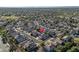 Expansive aerial view showcasing a peaceful residential neighborhood with well-maintained homes and desert landscaping at 15518 W Ocotillo Ln, Surprise, AZ 85374