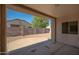 Covered back patio with view of low-maintenance gravel backyard, and concrete surfaces at 15518 W Ocotillo Ln, Surprise, AZ 85374
