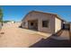 Spacious backyard showcasing a gravel landscape, concrete patio, block wall, and desert-friendly design at 15518 W Ocotillo Ln, Surprise, AZ 85374