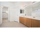 Bathroom with double sinks, tiled flooring, and separate shower at 15518 W Ocotillo Ln, Surprise, AZ 85374