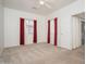Bright and airy bedroom featuring plush carpet and two bright windows at 15518 W Ocotillo Ln, Surprise, AZ 85374